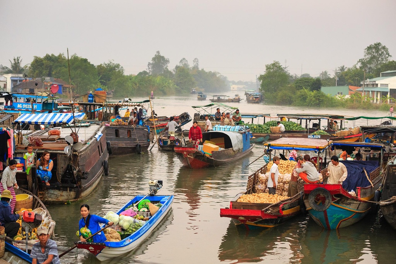 A bustling floating market on the Bassac River, filled with boats selling fruits, vegetables, and other goods, vibrant colors, Southern Vietnam